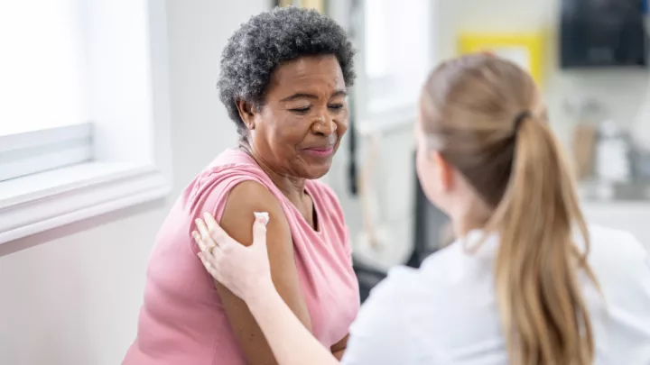 Older woman getting a shot