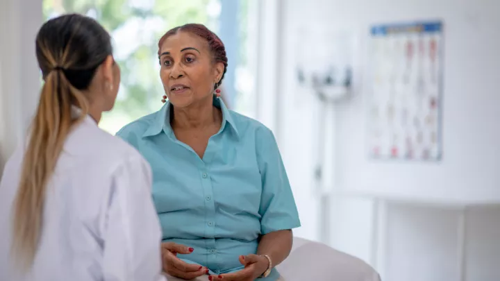 Older woman talking to her doctor