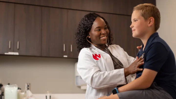 Nebraska Medicine physician with child patient