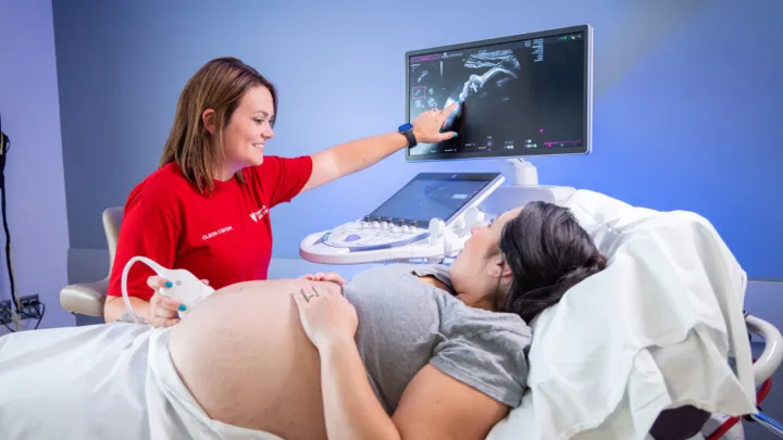 NM sonographer performing ultrasound on pregnant patient