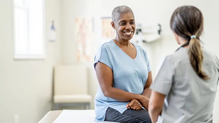 Older woman talking to her doctor