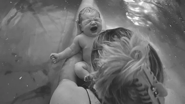 Jessica Schultze and daughter Margaret in water birth tub