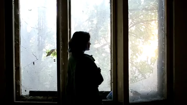 Woman looking out a window