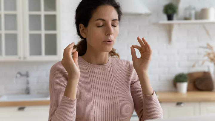 Woman doing calming breath