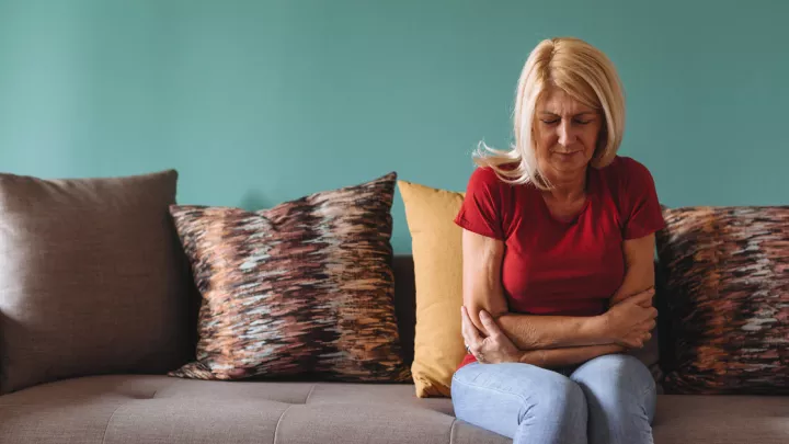 Woman holding her stomach
