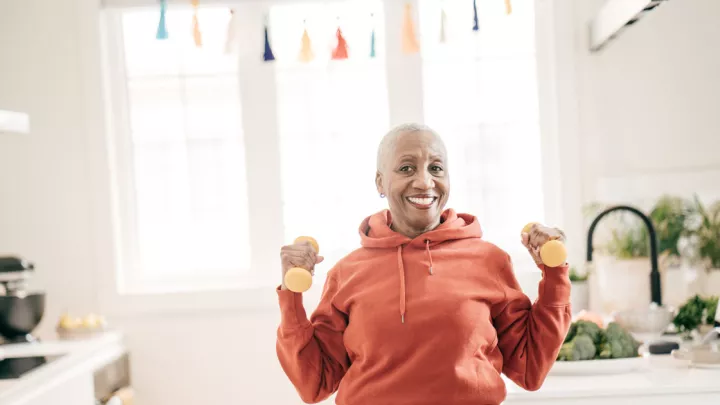 Woman holding dumbbells